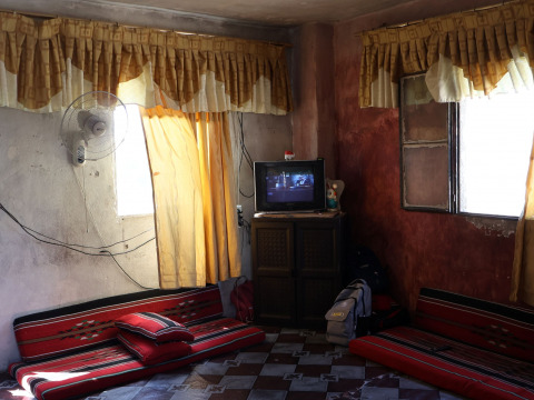 Transform Mohammad’s cramped room into a complete home with a kitchen, a bathroom, and a warm space for his family