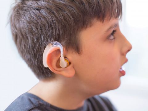 Omar needs a hearing aid due to severe hearing loss, but his mother cannot afford it on her limited income