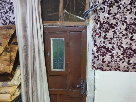 Muna, a widowed mother in her sixties, lives in a cold and cracked home. Support her in restoring safety to her house